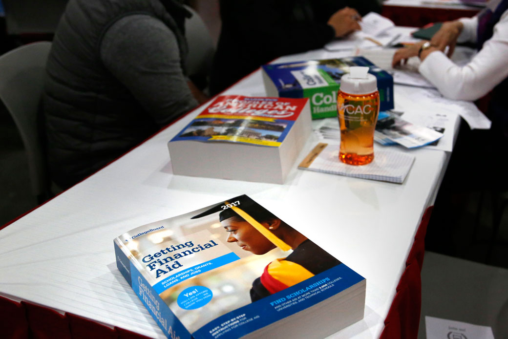 A book about financial aid is seen at a college fair in New York, March 2017. (AP/Seth Wenig)