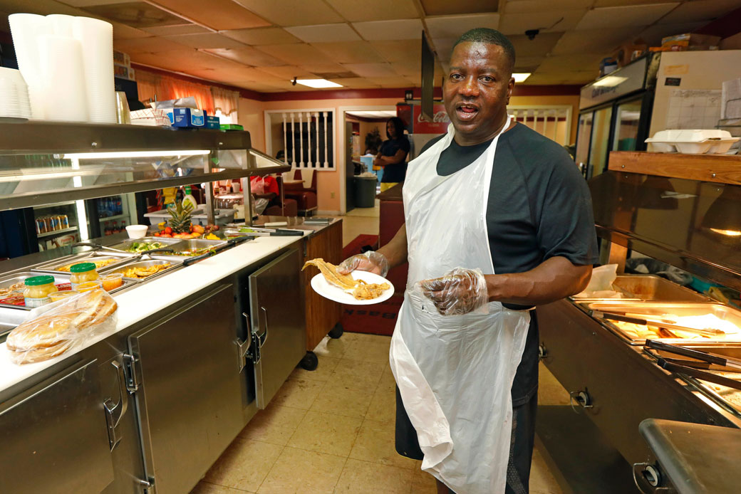 A small-business owner is seen in the kitchen of his restaurant in Belzoni, Mississippi, on  March 23, 2017. (AP/Rogelio V. Solis)