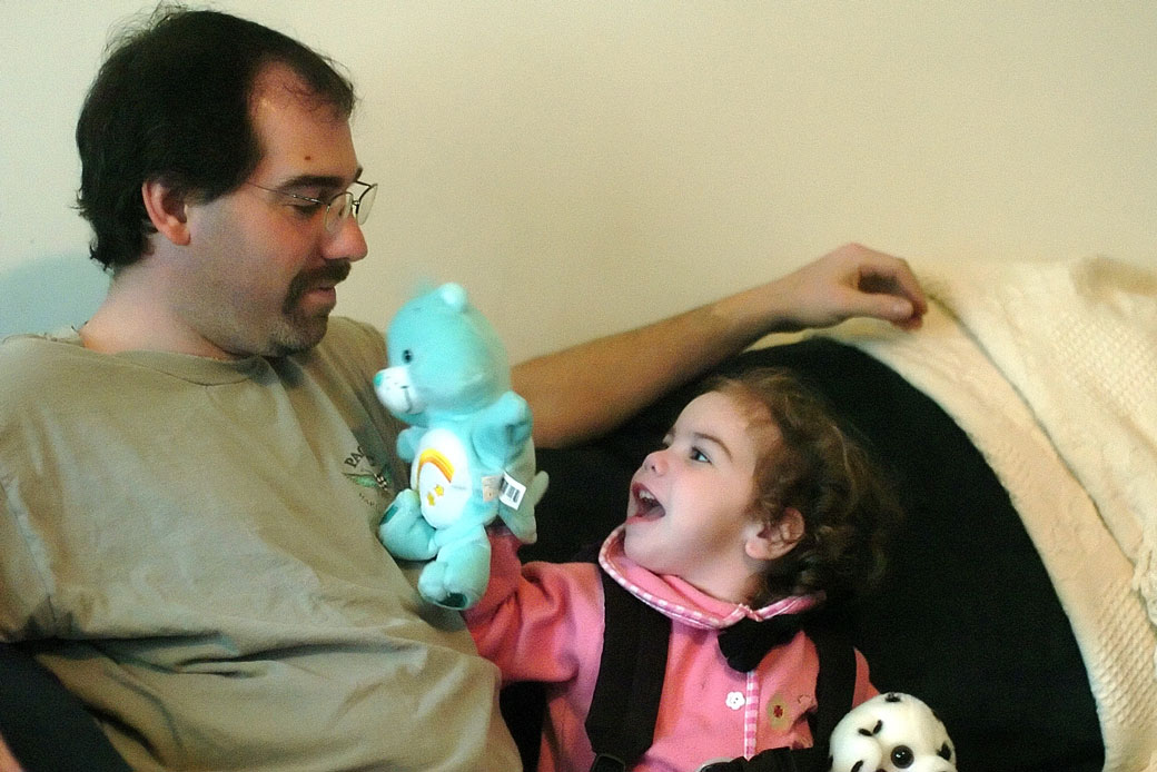Madeleine Mirante, age 3, plays with her father, Christopher Mirante, in their living room in Plainfield, Connecticut, on April 1, 2005. (AP/Bob Child)