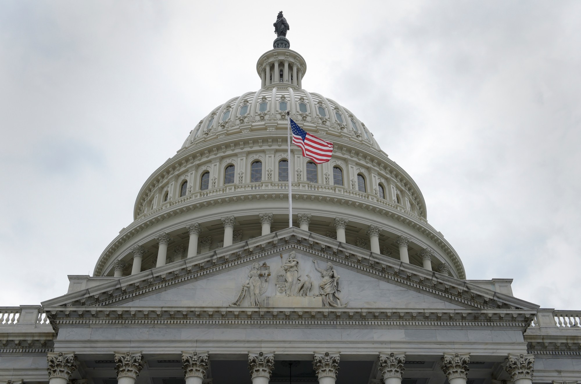 A flag flies in front of the Capitol dome on Capitol Hill in Washington, May 2017. (AP/Susan Walsh)