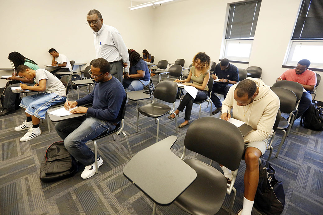 A professor monitors his students as they take a final exam at Jackson State University in Jackson, Mississippi, April 20, 2017. (AP/Rogelio V. Solis)