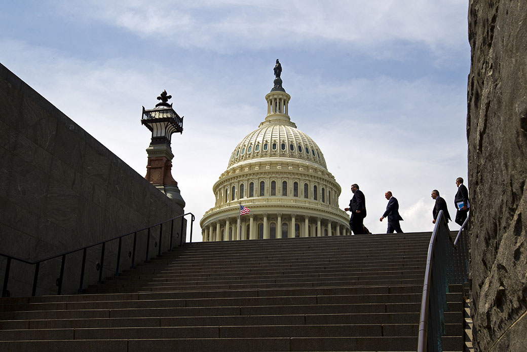 People walk outside the U.S. Capitol, April 27, 2017. (AP/Jose Luis Magana)