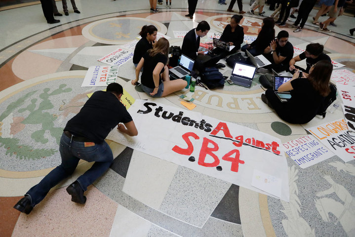 Students gather in the Rotunda at the Texas Capitol to oppose S.B. 4, a bill that already cleared the Texas Senate and seeks to jail sheriffs and other officials who refuse to help enforce federal immigration law, on Wednesday, April 26, 2017, in Austin, Texas. (AP Photo/Eric Gay)