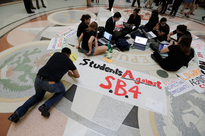 Students gather in the Rotunda at the Texas Capitol to oppose S.B. 4, a bill that already cleared the Texas Senate and seeks to jail sheriffs and other officials who refuse to help enforce federal immigration law, on Wednesday, April 26, 2017, in Austin, Texas. (AP Photo/Eric Gay)