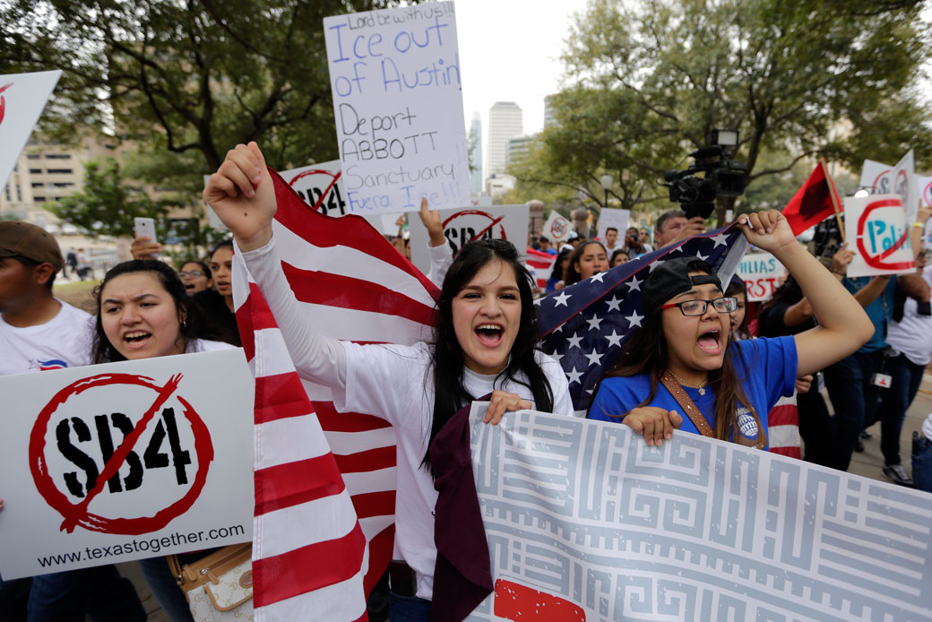 Protesters in Austin, Texas, take part in a rally to support the rights of immigrants, oppose a border wall, and support sanctuary cities, February 28, 2017. (AP/Eric Gay)