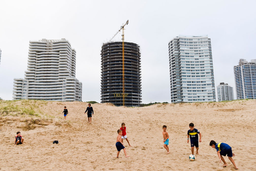 Children play in front of the Trump Tower under construction in Punta del Este, Uruguay, January 17, 2017. (AP/Matilde Campodonico)