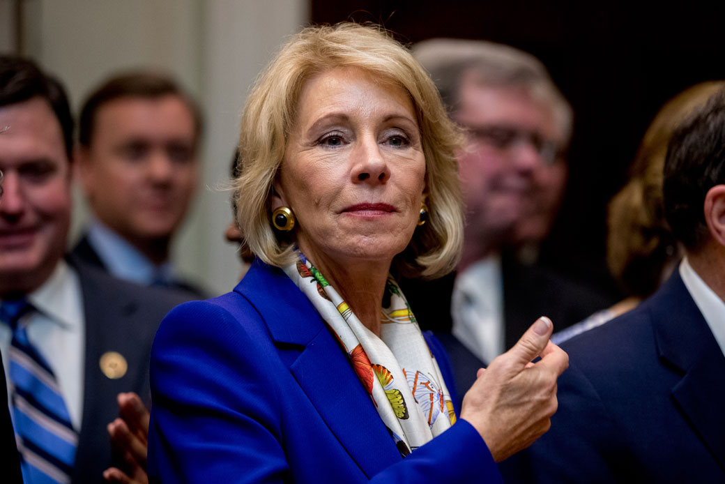 Secretary of Education Betsy DeVos waits for President Donald Trump to arrive in the Roosevelt Room of the White House in Washington, March 27, 2017. (AP/Andrew Harnik)