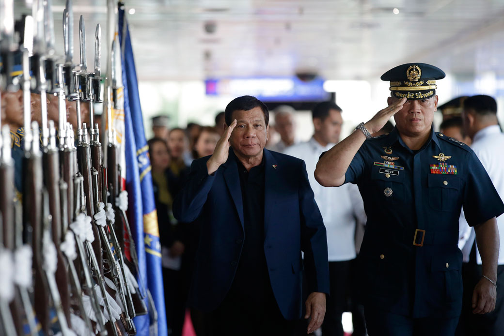 Filipino President Rodrigo Duterte salutes during an arrival honor at Manila's international airport in the Philippines, May 24, 2017. (AP/Aaron Favila)