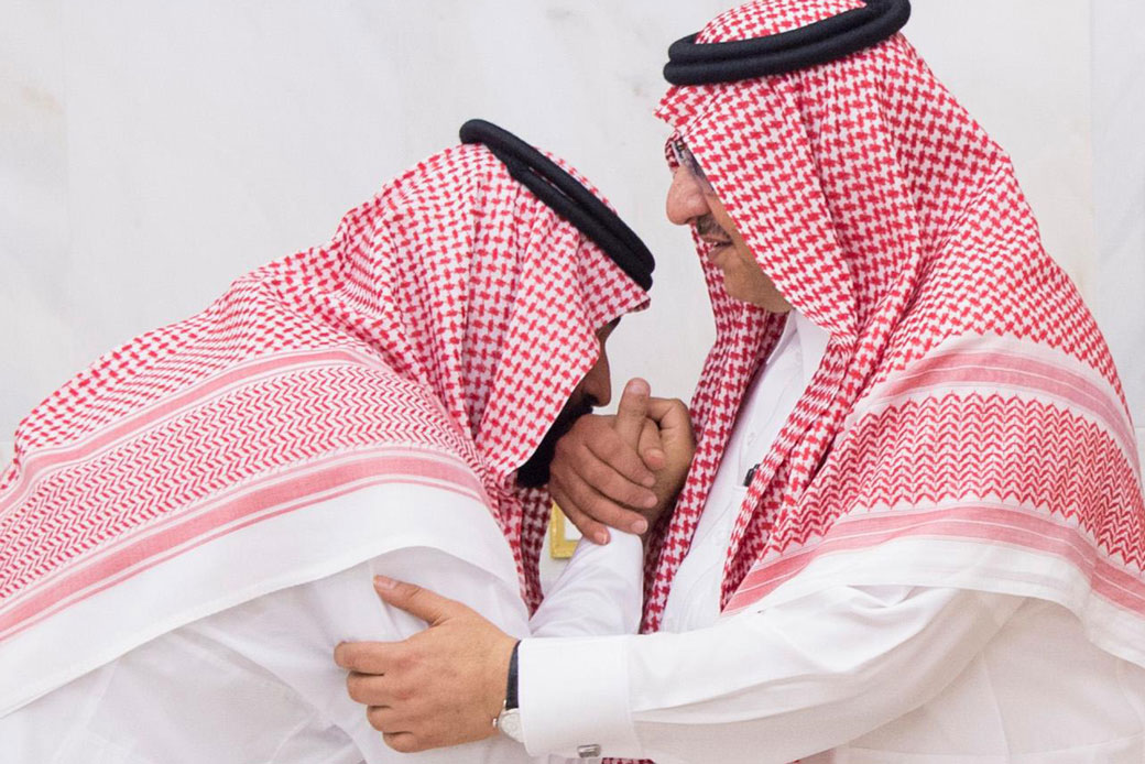 Newly appointed Crown Prince Mohammed bin Salman kisses the hand of Prince Mohammed bin Nayef at the royal palace in Mecca, Saudi Arabia, June 21, 2017. (Al-Ekhbariya via AP)