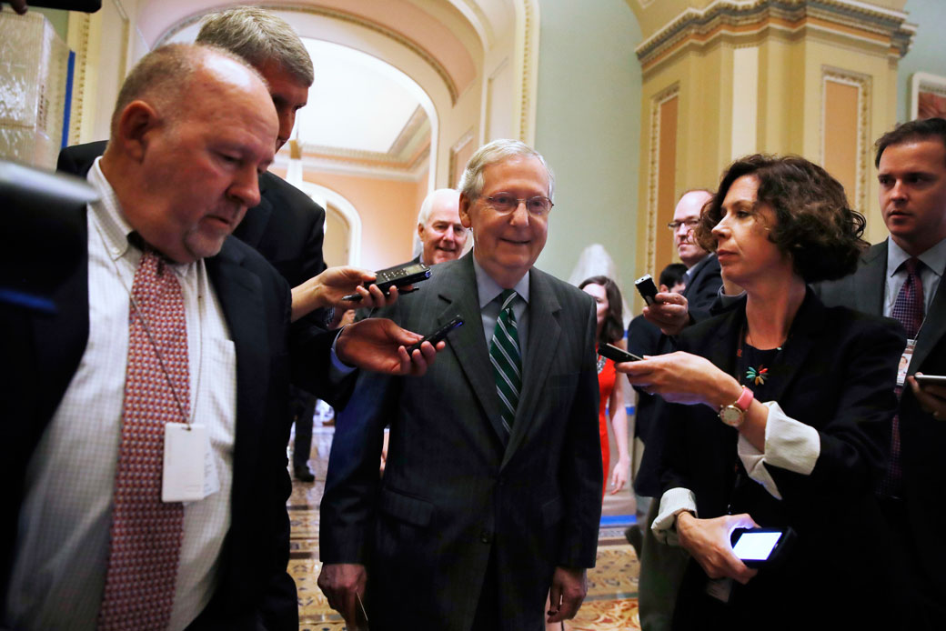 Senate Majority Leader Mitch McConnell followed by Majority Whip John Cornyn leaves a Republican meeting on health care, June 2017. (AP/Jacquelyn Martin)