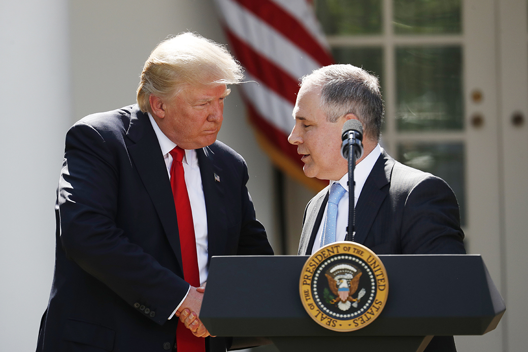 President Donald Trump shakes hands with EPA Administrator Scott Pruitt after speaking in the Rose Garden of the White House in Washington, June 1, 2017. (AP/Pablo Martinez Monsivais)