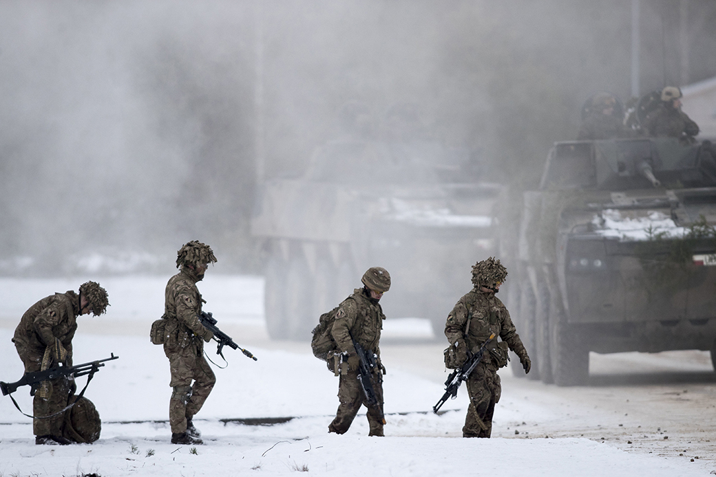 Soldiers take part in a NATO military exercise at a training range in Pabrade, north of the capital Vilnius, Lithuania, December 2016.