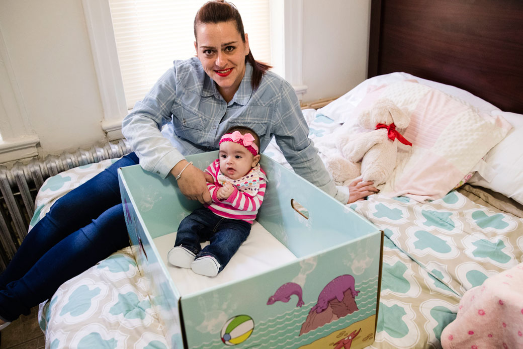 Dolores Peterson and her three-month-old daughter, Ariabella, pose for a photograph at their home in Camden, New Jersey, March 6, 2017. (AP/Matt Rourke)