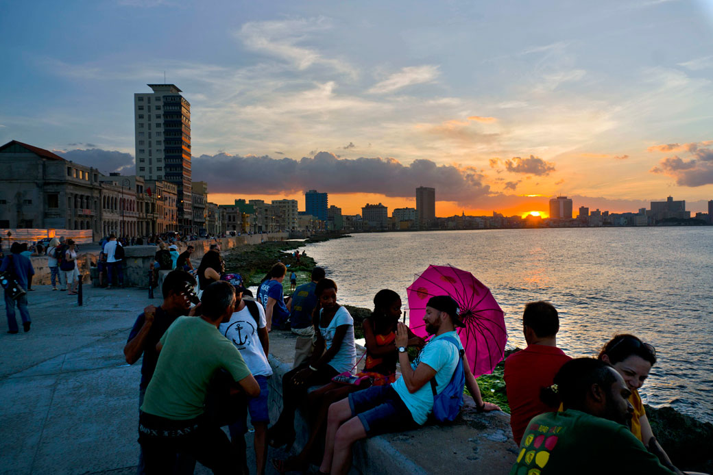 People sit on the Havana seawall in Cuba, November 9, 2016. (AP/Ramon Espinosa)