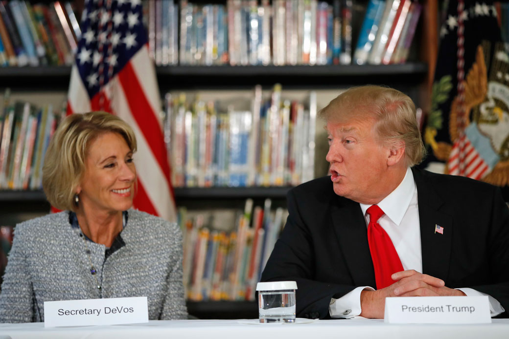 Education Secretary Betsy DeVos listens as President Donald Trump speaks during a roundtable discussion in Orlando, Florida, on March 3, 2017. (AP/Alex Brandon)