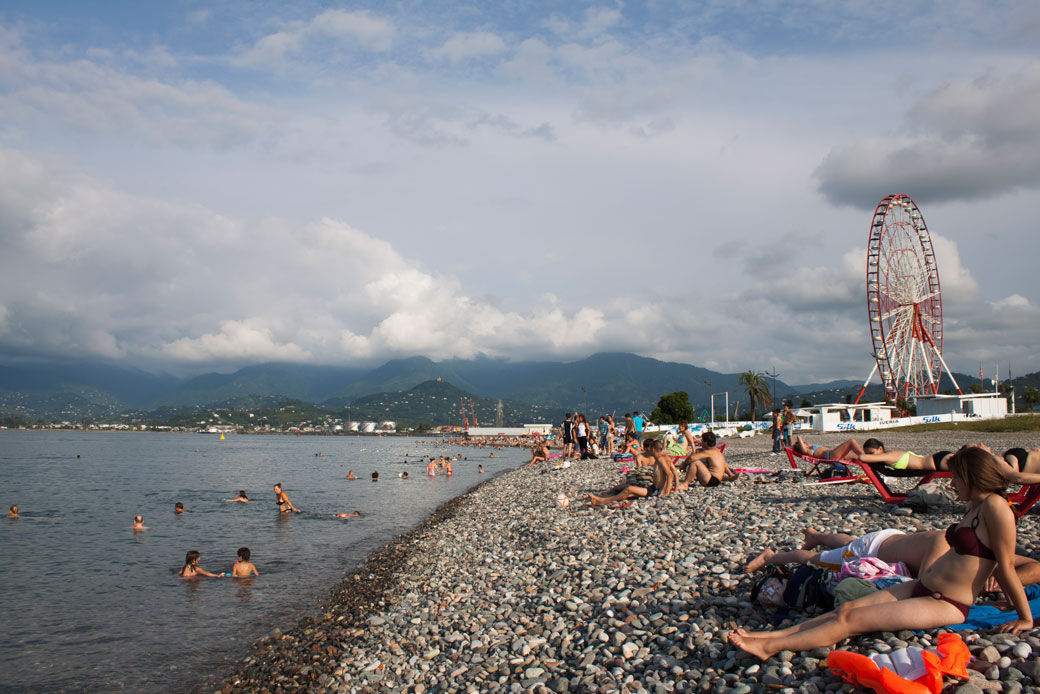 Tourists swim and sunbathe in the Black Sea resort town of Batumi, Georgia, August 1, 2012. (AP/Maria Danilova)