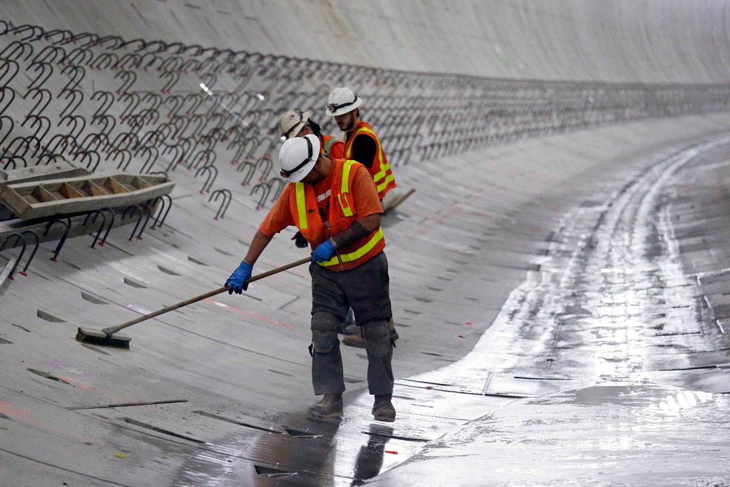 Workers clean inside the Washington State Route 99 tunnel in Seattle, December 2016. (AP/Elaine Thompson)