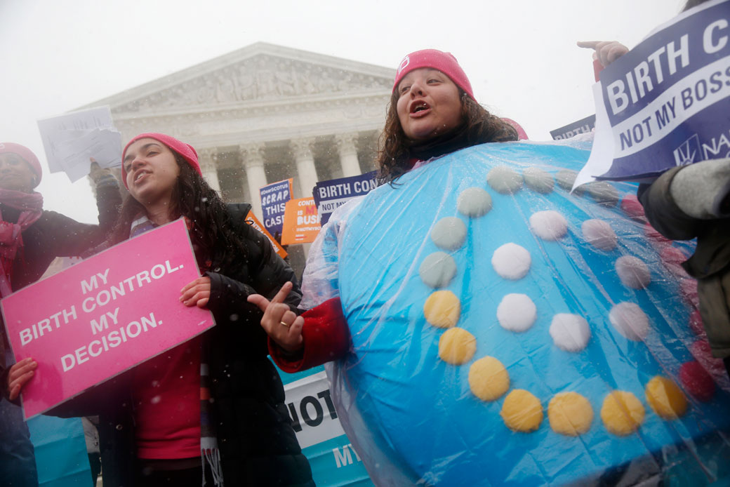 Protestors participate in a demonstration in front of the Supreme Court in Washington, March 25, 2015. (AP/Charles Dharapak)