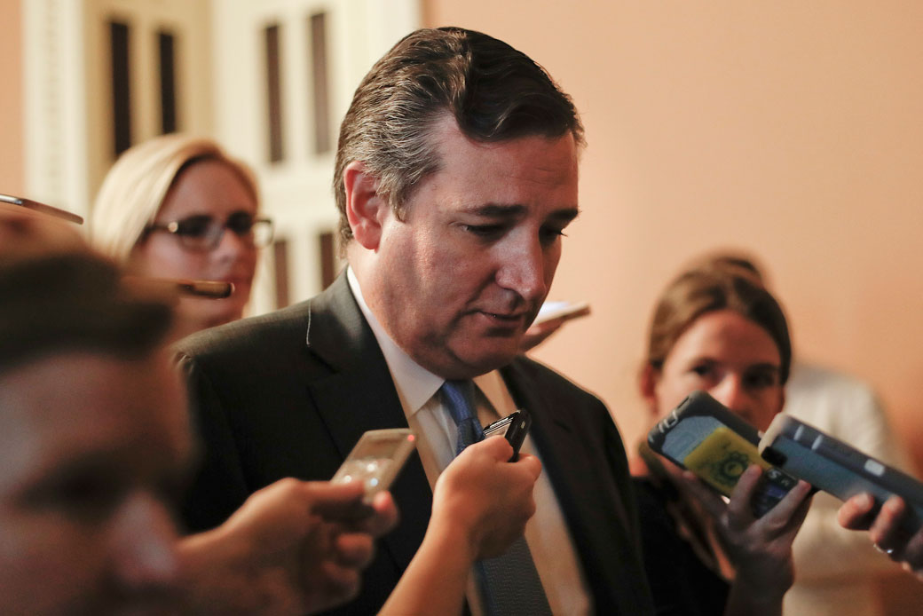 Sen. Ted Cruz (R-TX) is pursued by members of the media while walking the hallways on Capitol Hill in Washington, Thursday, July 13, 2017. (AP/Pablo Martinez Monsivais)