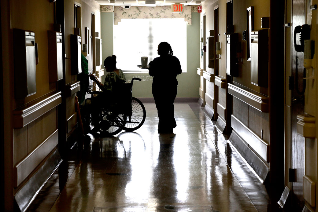 A patient is assisted at Southeastern Regional Medical Center in Lumberton, North Carolina, July 10, 2014. (AP/Gerry Broome)