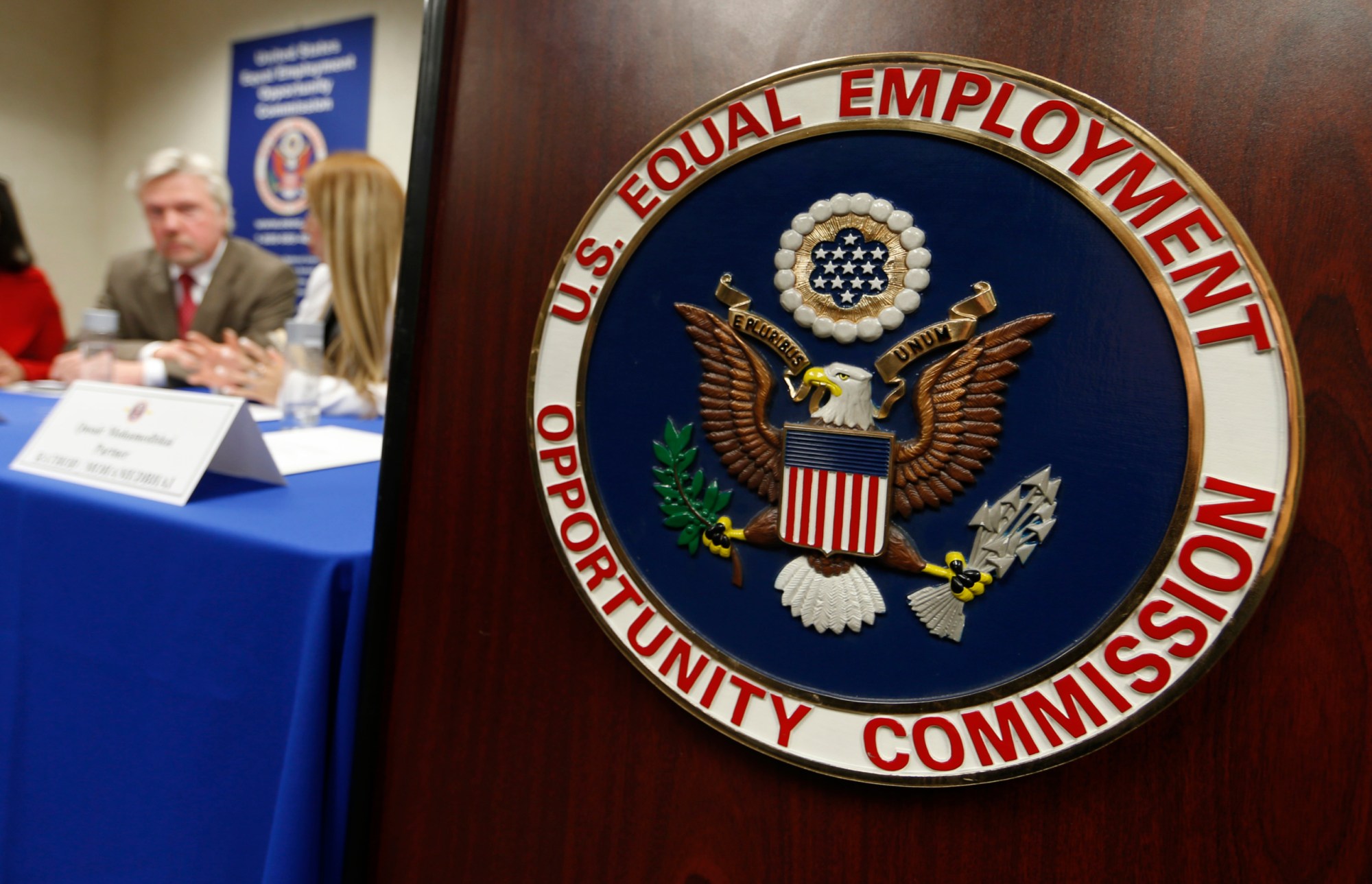 A plaintiff, center, speaks after a news conference in the field office of the U.S. Equal Employment Opportunity Commission to announce a settlement in their case in Denver, February 2016. (AP/David Zalubowski)