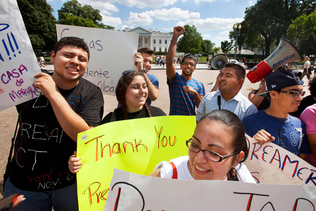 In this June 15, 2012 photo, undocumented immigrants who live in Maryland, hold signs saying 