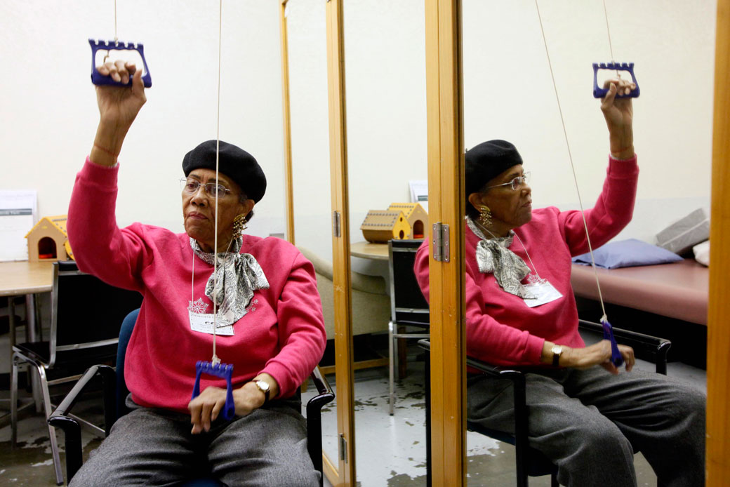 A woman works out at the Adult Day Health Care center in Los Angeles, March 8, 2011. (AP/Nick Ut)