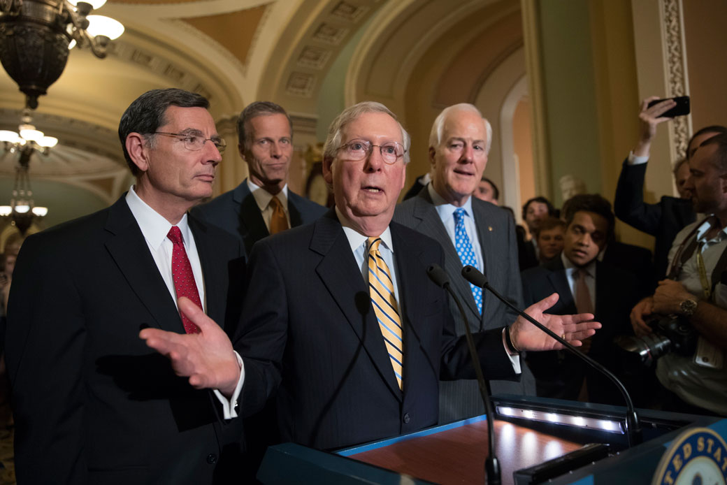 Senate Majority Leader Mitch McConnell (R-KY), joined by, from left, Sen. John Barrasso (R-WY), Sen. John Thune (R-SD), and Majority Whip John Cornyn (R-TX), speaks with reporters on Capitol Hill in Washington, Tuesday, July 25, 2017. (AP/J. Scott Applewhite)