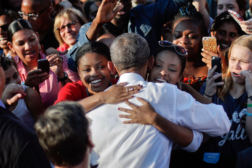Two women embrace former President Barack Obama at the University of North Carolina, November 2, 2016. (AP/Pablo Martinez Monsivais)