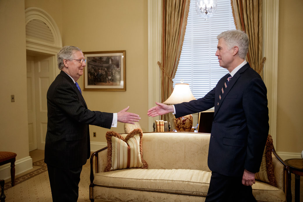 Then-Supreme Court Justice nominee Neil Gorsuch is greeted by Senate Majority Leader Mitch McConnell on Capitol Hill in Washington, February 2017. (AP/J. Scott Applewhite)