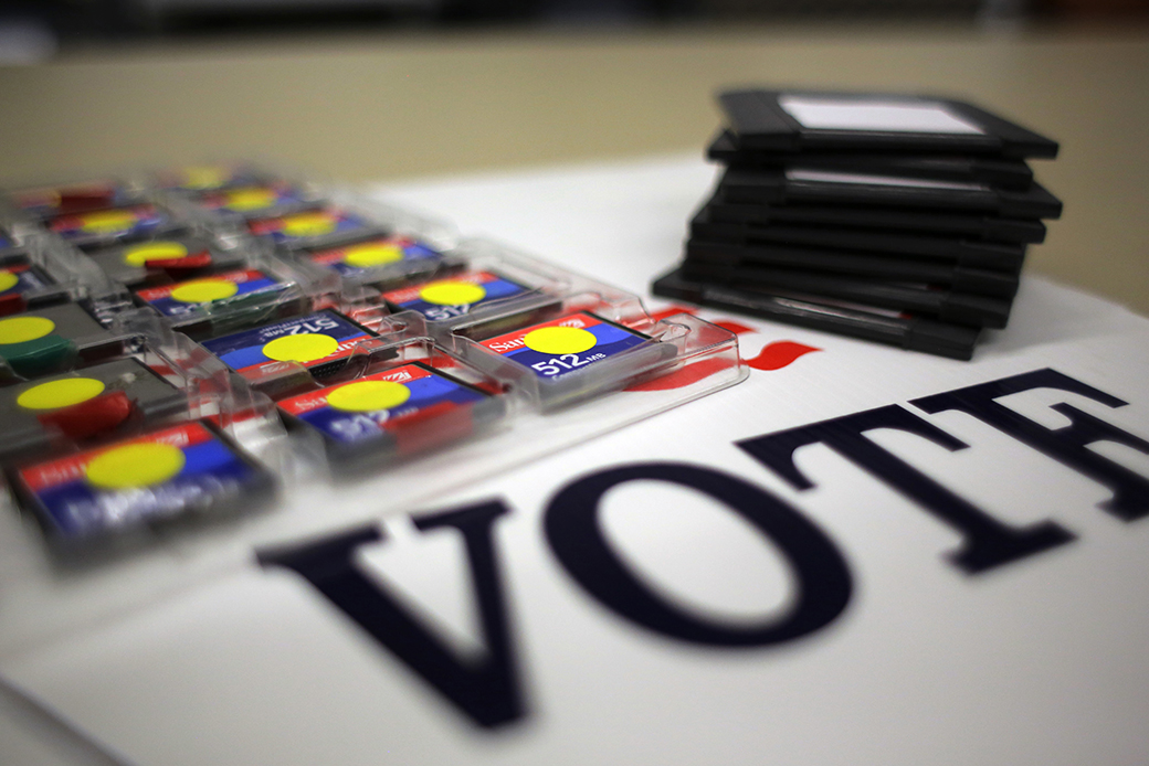 A stack of zip disks and a tray of compact flash cards are seen at an elections office in Texas, March 2017. (AP/Eric Gay)