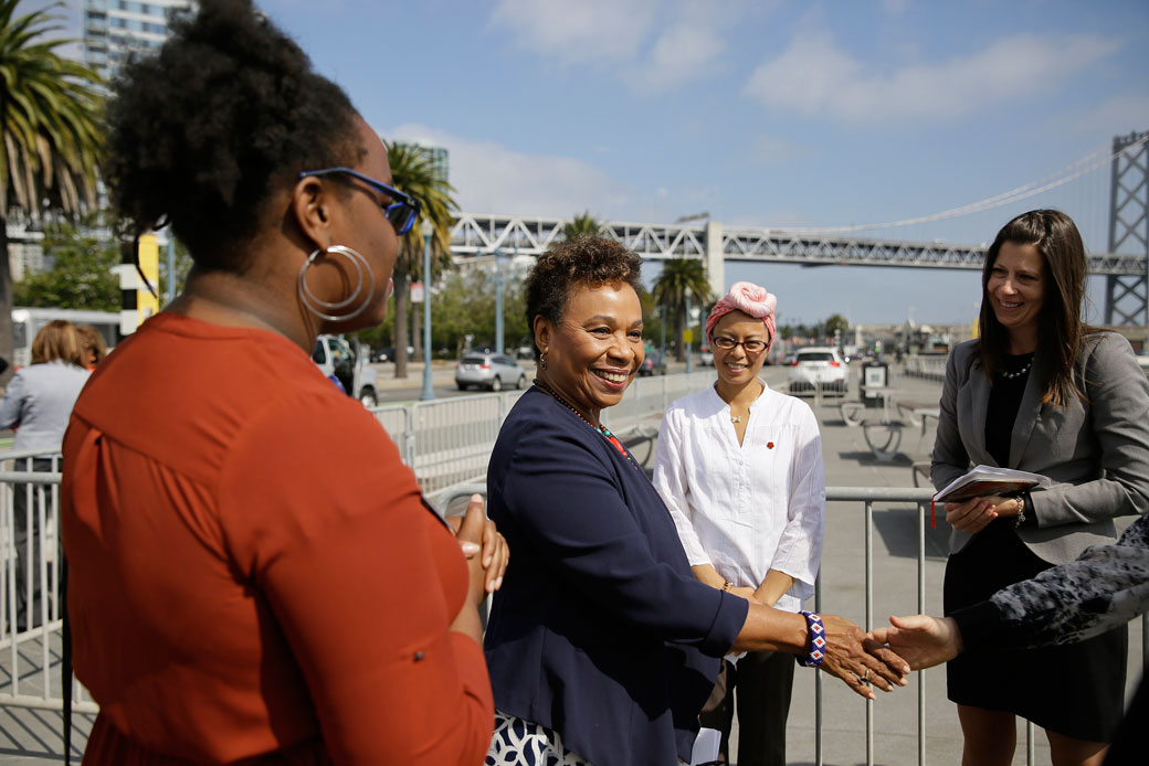Rep. Barbara Lee (D-CA) shakes hands before the start of an event to commemorate Women's Equality Day on August 22, 2017, in San Francisco. ((AP/Eric Risberg))
