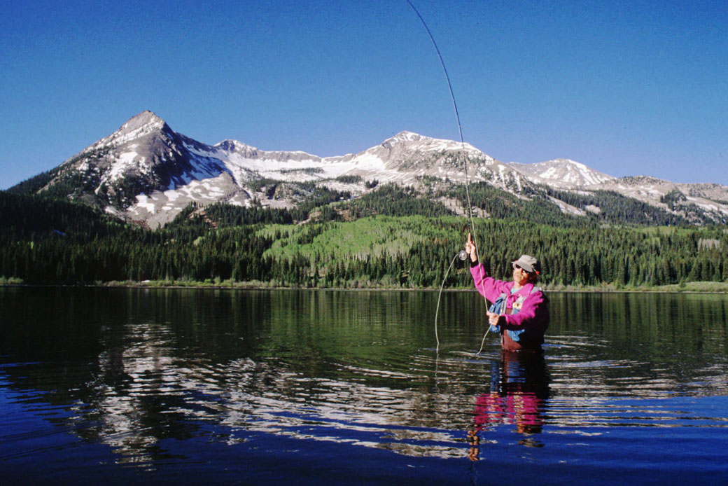 Rene DeFourneaux fly fishes for trout at Lost Lake near Crested Butte, Colorado, in this undated file photo. (AP/Nathan Bilow)