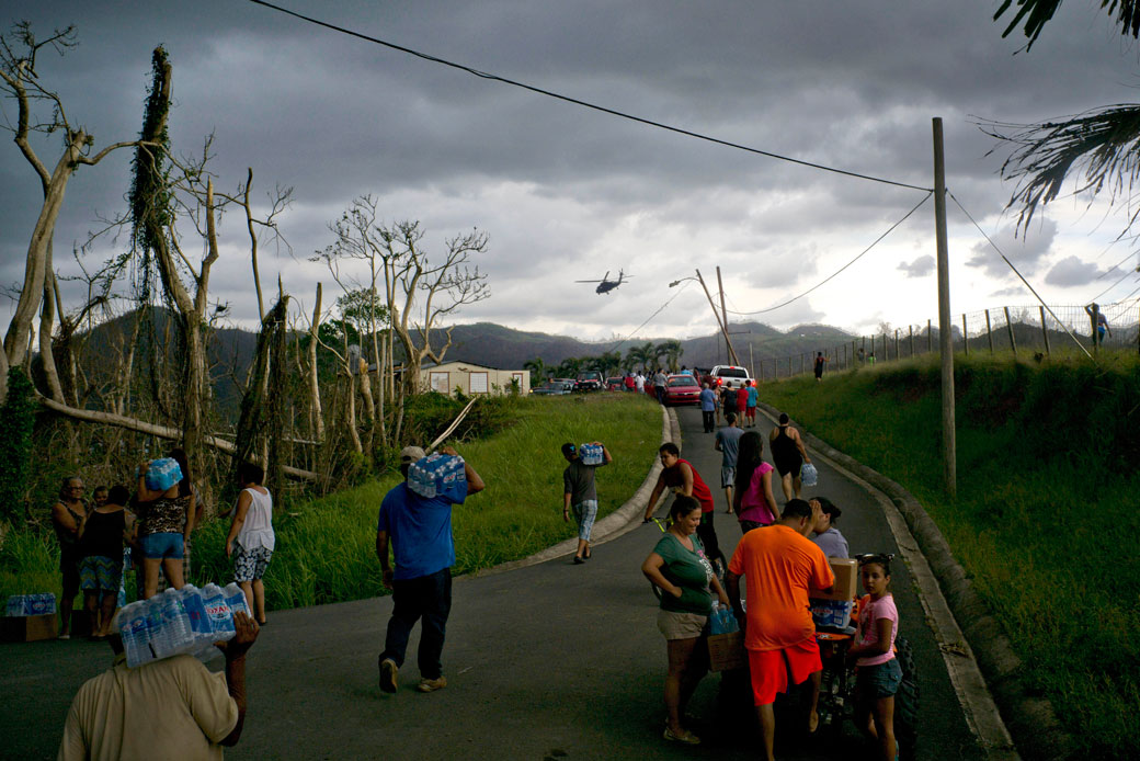 Victims of Hurricane Maria carry supplies in Morovis, Puerto Rico, October 7, 2017. (AP/Ramon Espinosa)