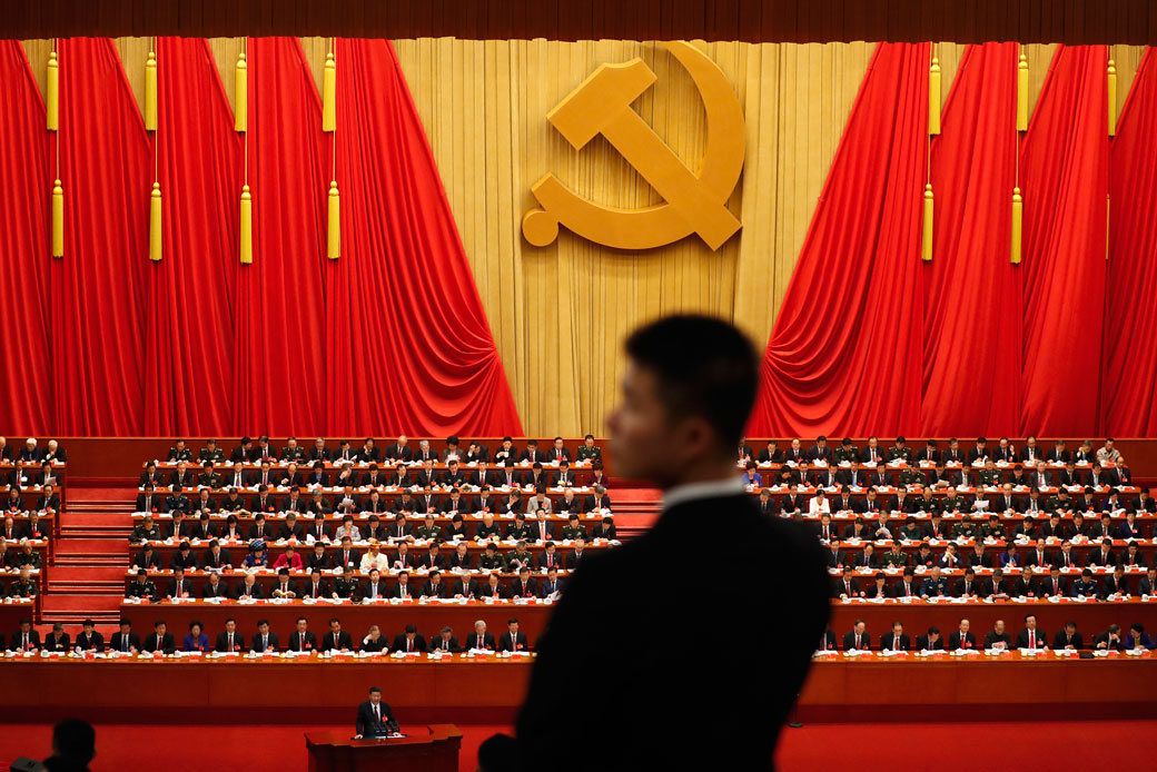 A soldier stands watch as Chinese President Xi Jinping delivers a speech at the opening ceremony of the 19th Party Congress in the Great Hall of the People in Beijing, October 18, 2017. (AP/Andy Wong)