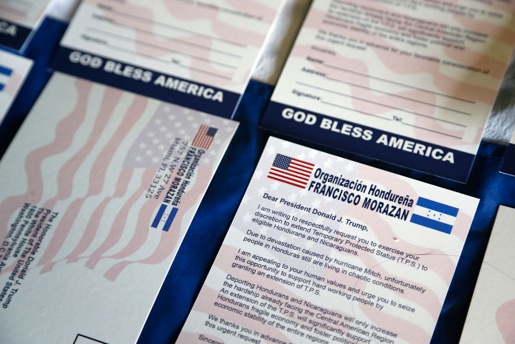 Postcards addressed to President Donald Trump asking him to extend Temporary Protected Status for tens of thousands of Central Americans and Haitians are shown during a news conference in Miami, Florida, June 7, 2017. (AP/Wilfredo Lee)