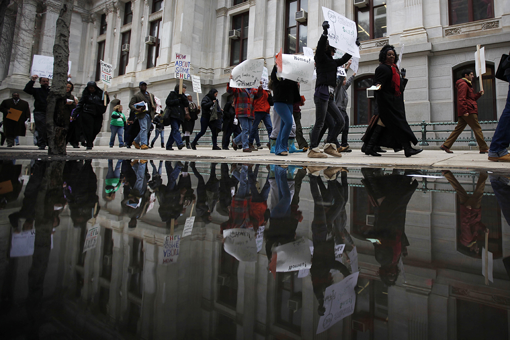 Protesters facing foreclosure and their advocates march March 24, 2011, outside City Hall in Philadelphia, Pennsylvania. (AP/Matt Rourke)