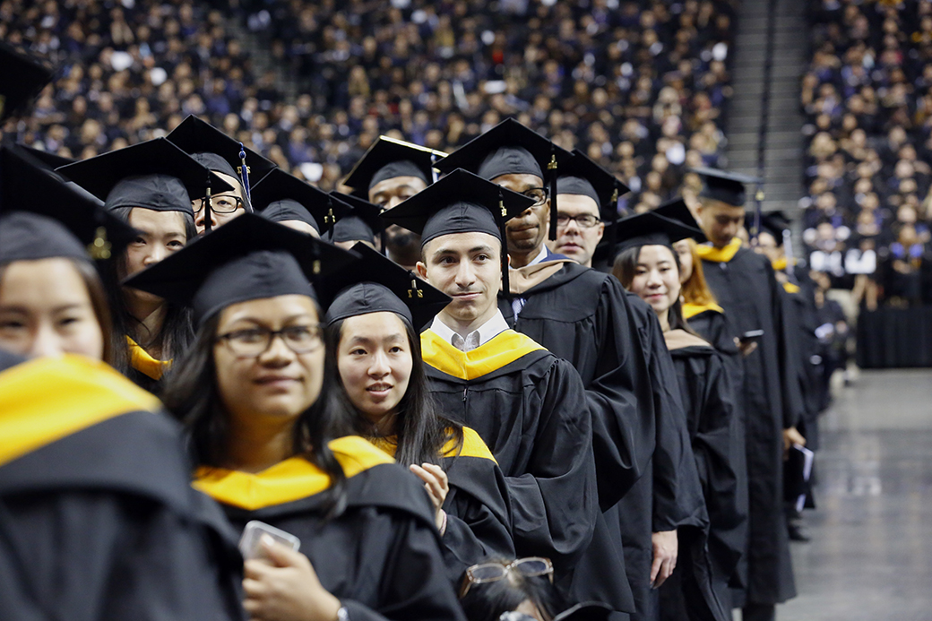 College graduates participate in a commencement program, June 2017, in the Brooklyn borough of New York. ((AP/Bebeto Matthews))