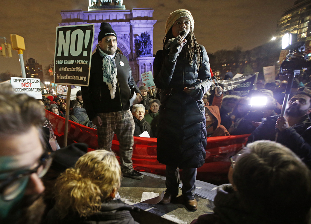 A woman speaks to demonstrators during what was billed as the second in a series of 