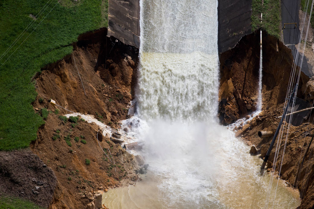 Water drains from the Guajataca Dam in Quebradillas, Puerto Rico, following Hurricane Maria, September 23, 2017. (Associated Press)