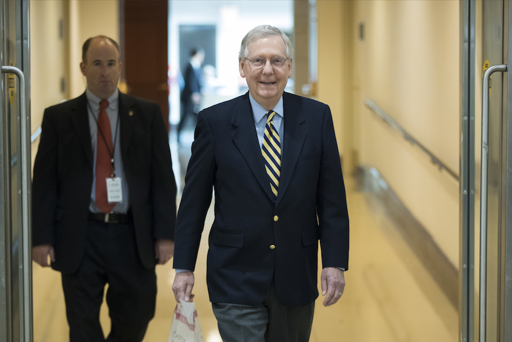 Senate Majority Leader Mitch McConnell (R-KY) walks through the Capitol as lawmakers discuss taxes and spending on Monday, November 27, 2017. (AP/J. Scott Applewhite)