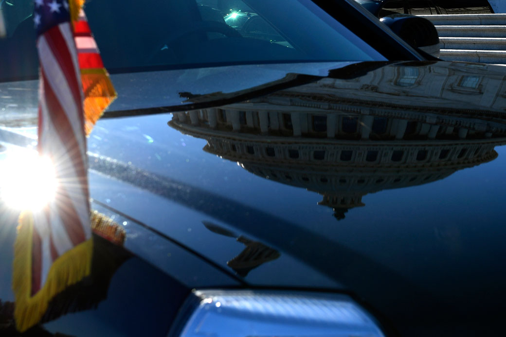 The Capitol Dome is reflected on the hood of one of the presidential limousines as it is parked on Capitol Hill in Washington, November 2017. (AP/Susan Walsh)