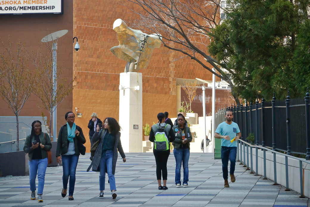 Students walk at a community college. (AP/Bebeto Matthews)
