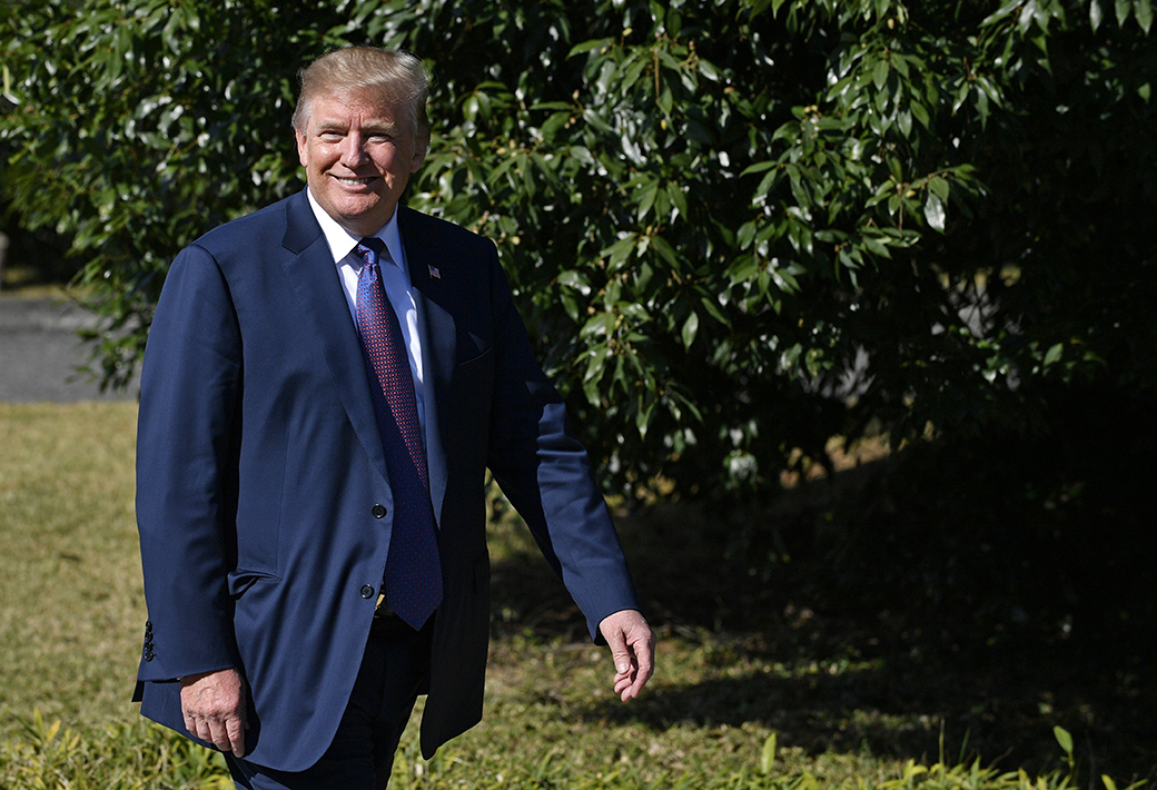 U.S. President Donald Trump walks on his way to meet Japanese Prime Minister Shinzo Abe upon his arrival at the Kasumigaseki Country Club in Kawagoe, near Tokyo, November 5, 2017. (Franck Robichon/Pool Photo via AP)