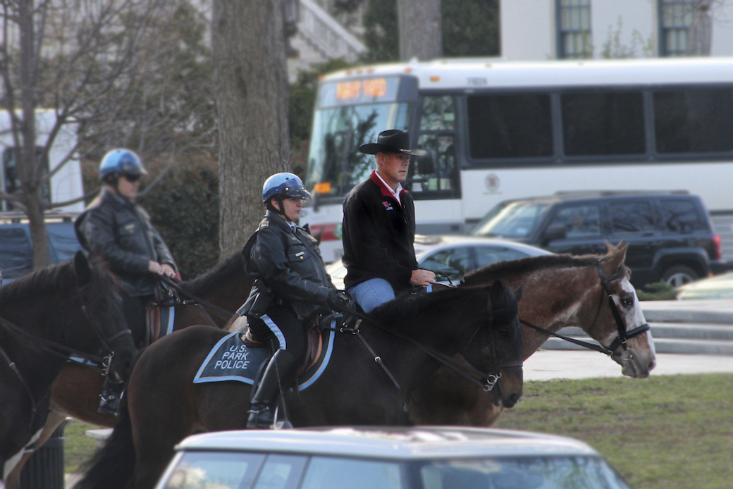 Interior Secretary Ryan Zinke arrives on horseback for his first day of work in Washington, D.C., March 2, 2017. (AP/Interior Department)