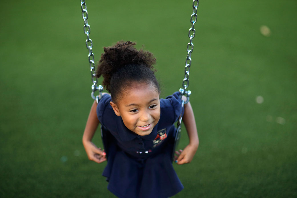 A 6-year-old sits on a swing at a child development center in Las Vegas, September 13, 2017. (AP/John Locher)