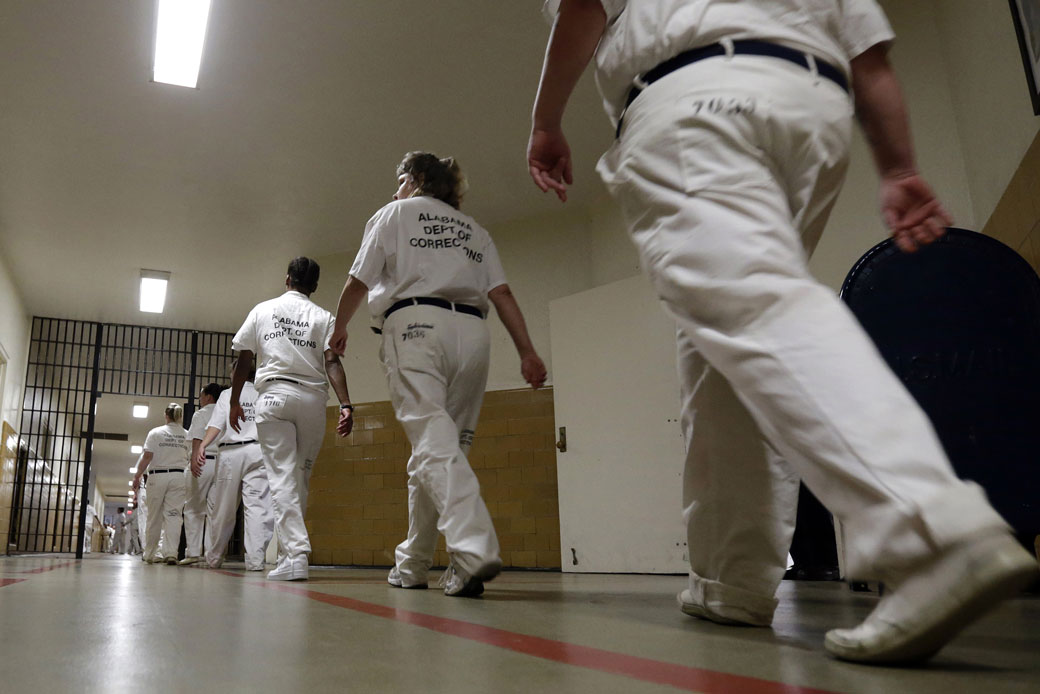 Inmates walk the halls in formation at Tutwiler Prison for Women in Wetumpka, Alabama, September 2013. (AP/Dave Martin)
