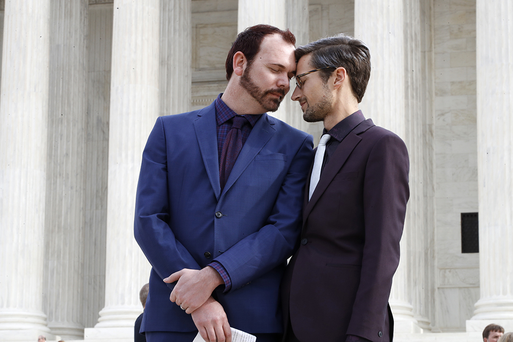 Charlie Craig, left, and David Mullins touch foreheads after leaving the Supreme Court, which heard <em>Masterpiece Cakeshop v. Colorado Civil Rights Commission</em>, December 5, 2017, in Washington. (AP/Jacquelyn Martin)
