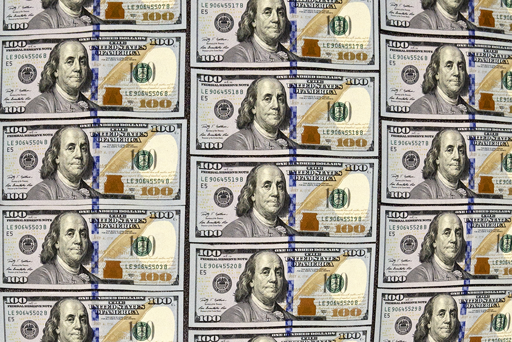 U.S. currency in 100 dollar denominations is displayed for illustration purposes, in Washington, March 31, 2014. (AP/J. Scott Applewhite)