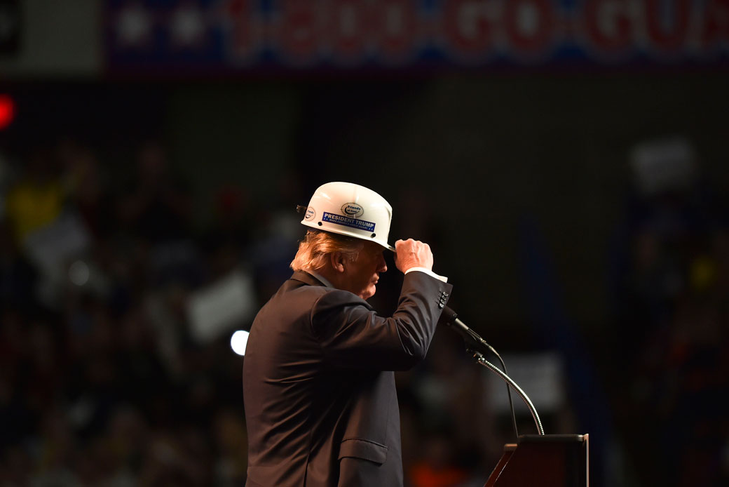 Then-presidential candidate Donald Trump wears a coal miner's protective hat while addressing his supporters during a rally at the Charleston Civic Center on May 5, 2016, in Charleston, West Virginia. (Getty/Ricky Carioti/The Washington Post)